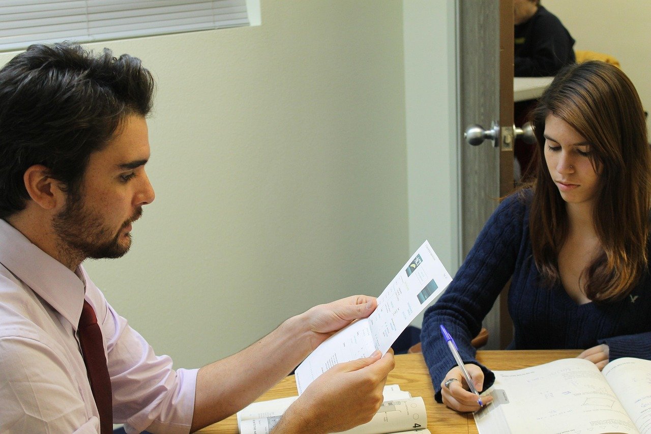 Tutor and student working together